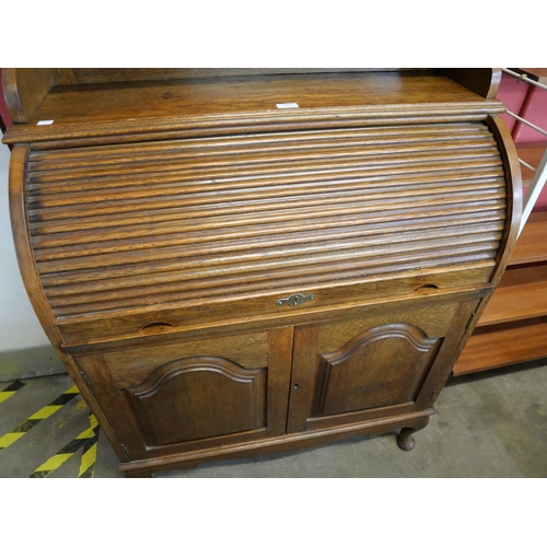 156 - An Edward VII oak tambour bureau bookcase, with Art Nouveau stained glass doors