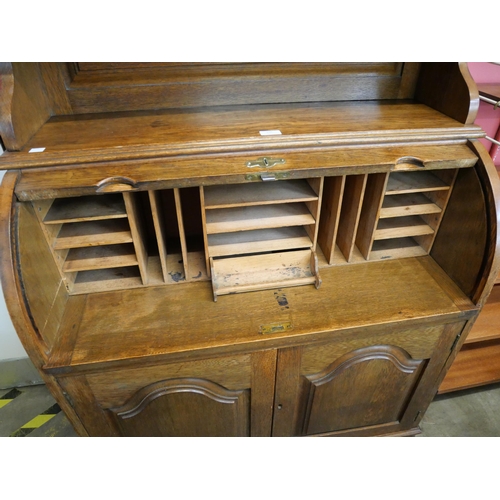 156 - An Edward VII oak tambour bureau bookcase, with Art Nouveau stained glass doors