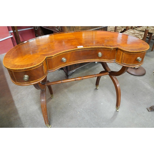 161 - A Regency style inlaid kidney shaped writing table