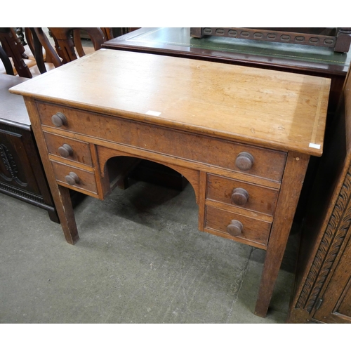 171 - A Victorian oak five drawer side table