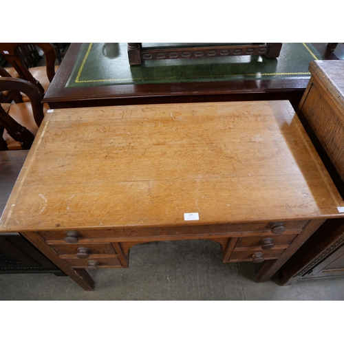 171 - A Victorian oak five drawer side table