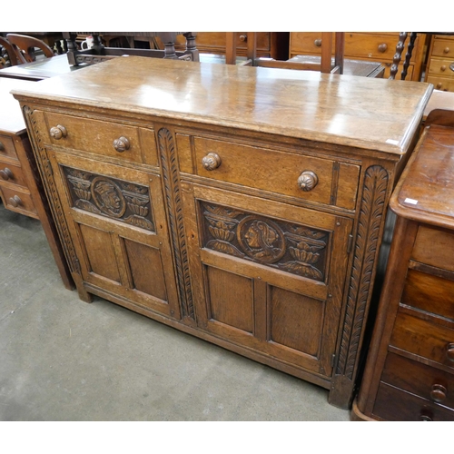 172 - An Elizabethan Revival carved Ipswich oak dresser