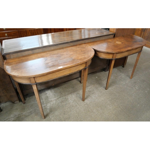 174 - A pair of George IV mahogany D-shaped console tables