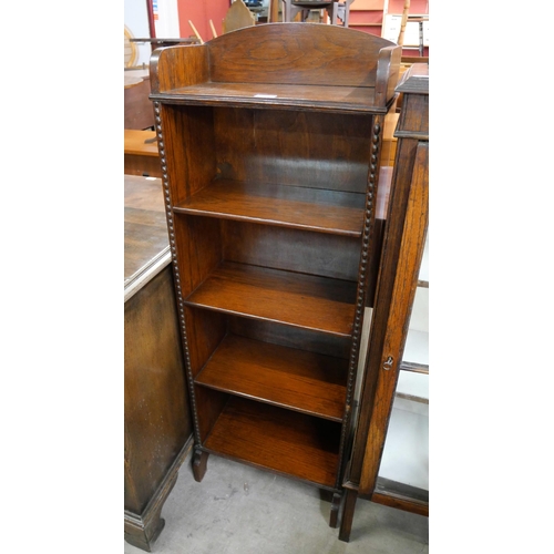 176 - An early 20th Century oak open bookcase