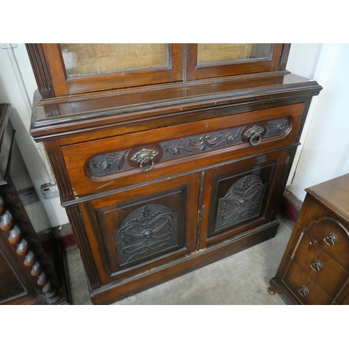 179 - An Edward VII carved walnut secretaire bookcase