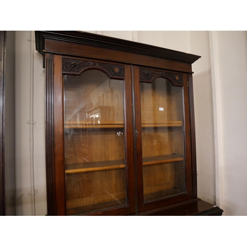 179 - An Edward VII carved walnut secretaire bookcase