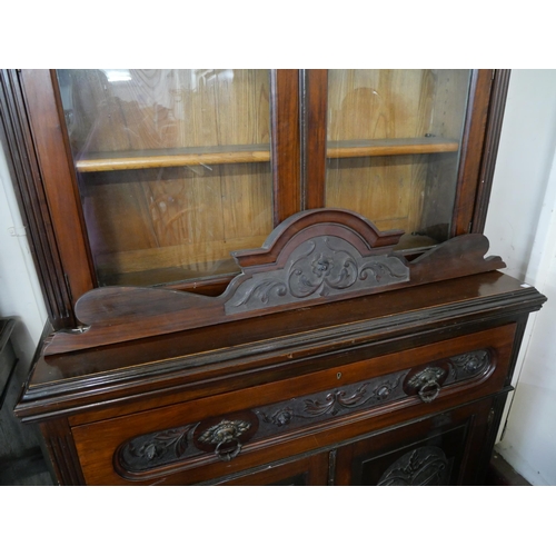 179 - An Edward VII carved walnut secretaire bookcase