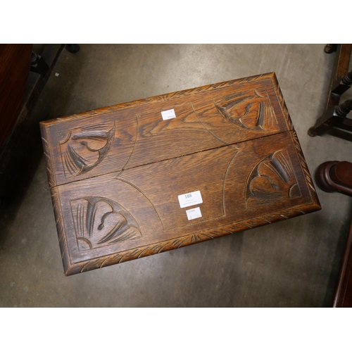 188 - An early 20th Century carved oak stool