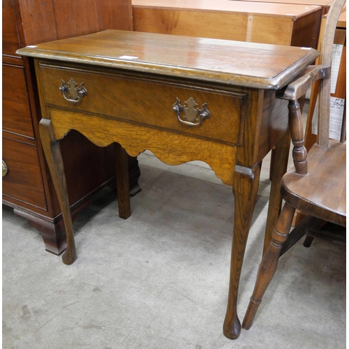 199 - A George II style oak single drawer side table