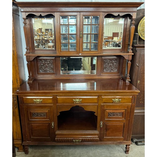 139 - An Edward VII carved walnut mirrorback sideboard