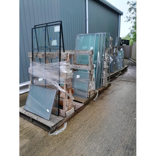 28 - Three trolleys of double-glazed window glass in varying sizes. Lot is offered for sale in situ at We... 