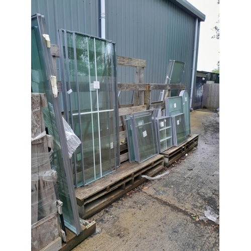 28 - Three trolleys of double-glazed window glass in varying sizes. Lot is offered for sale in situ at We... 