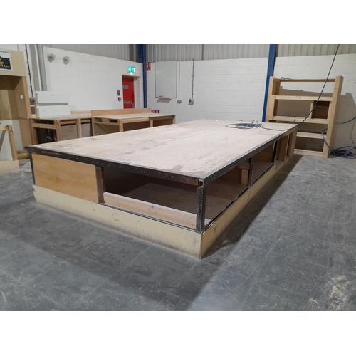 A large workbench measuring 8.5m x 2.6m x 0.45m (LWH). The bench was designed to allow assembly of park home roof trusses. Item is offered for sale in situ at Wellingborough, Northamptonshire. Lot to be collected from the premises before Friday 31st May. Viewing available by appointment at premises - please call 07356 135328 to arrange. *This lot is subject to VAT.
