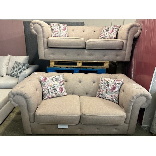 1533 - A pair of biscuit upholstered Chesterfield sofas