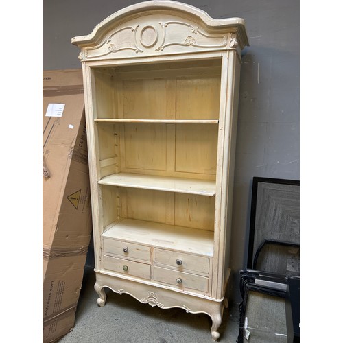 1567 - An ornate style cream painted bookcase with four drawers