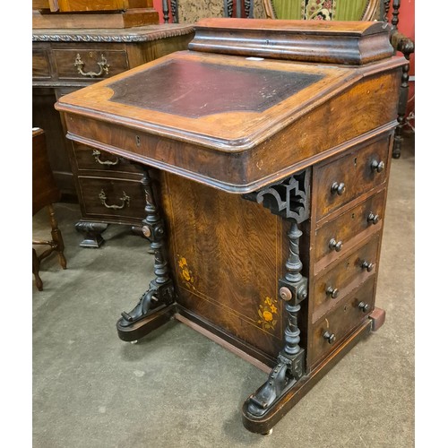 132 - A Victorian inlaid walnut Davenport