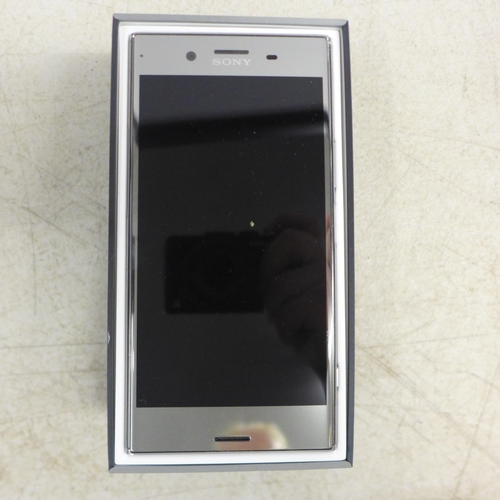 2095 - A Sony Experia X2 Premium G8141 smart phone with charging cable and replacement screen protector - i... 