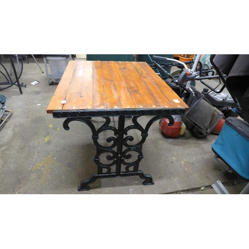 2273 - A cast metal and wood garden table - 94cm x 74cm