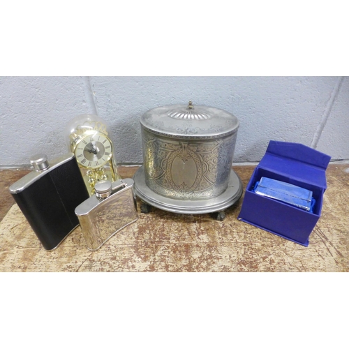 1005 - Two hip flasks, a quartz anniversary clock, a glass paperweight, boxed and a plated tea caddy **PLEA... 