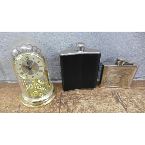 1005 - Two hip flasks, a quartz anniversary clock, a glass paperweight, boxed and a plated tea caddy **PLEA... 