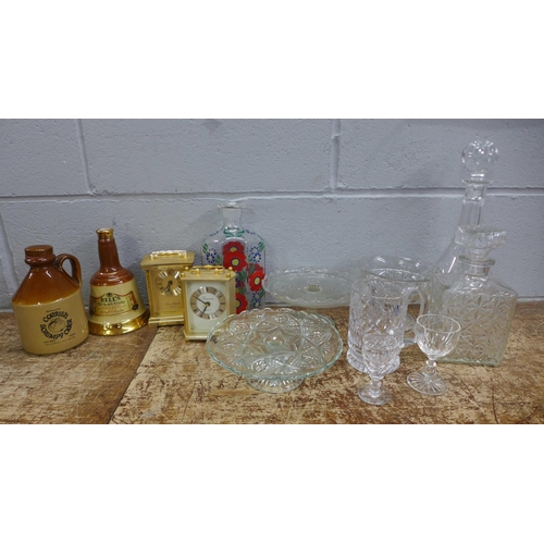 1018 - A crystal decanter and a collection of glassware, two carriage clocks, a Royal Doulton crystal tanka... 