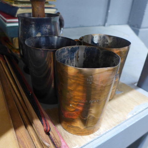 1029 - A collection of pewter and plated tankards, a Tilley lamp, a Canadian railroad spike, boxed, books, ... 