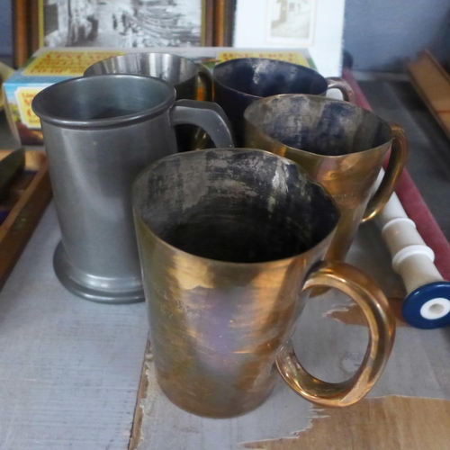 1029 - A collection of pewter and plated tankards, a Tilley lamp, a Canadian railroad spike, boxed, books, ... 