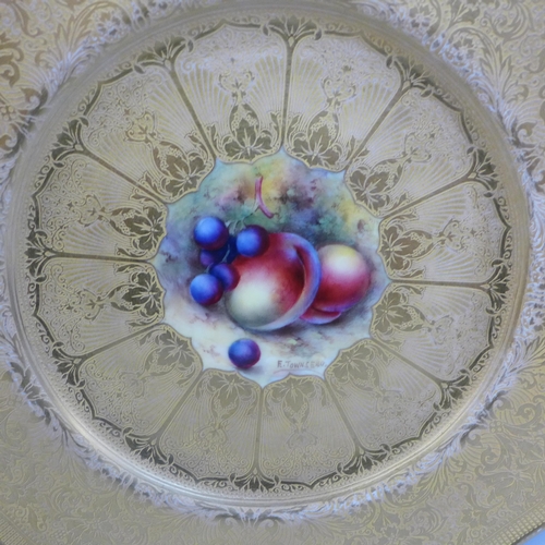 609 - A Royal Worcester gold cabinet plate with central still life painting of fruit, signed E. Townsend