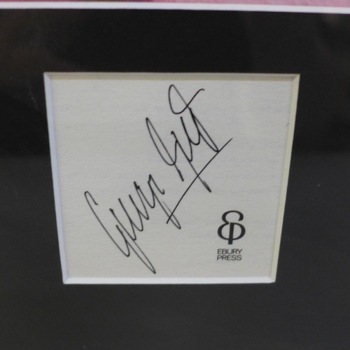 611 - A George Best signed hardback book display with certificate of authenticity on reverse, framed