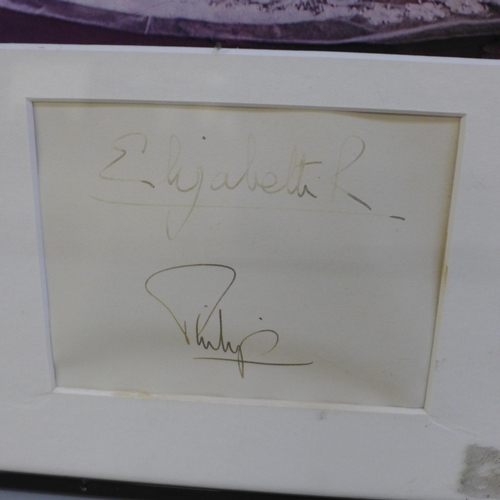 612 - A framed photograph of Queen Elizabeth II & Prince Phillip with associated signatures