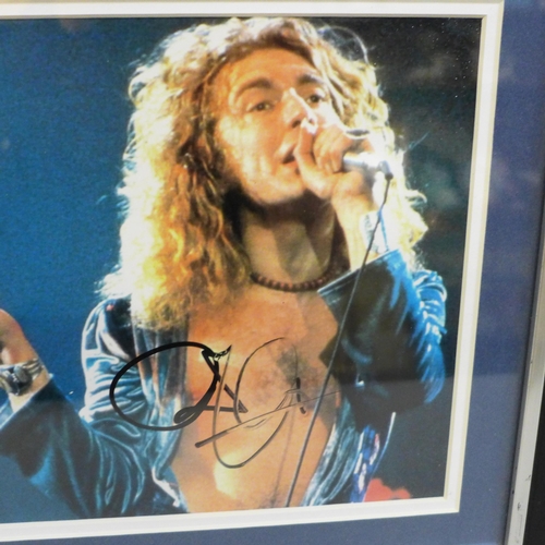 613 - A framed Robert Plant (Led Zeppelin) photograph with signature and certificate of authenticity