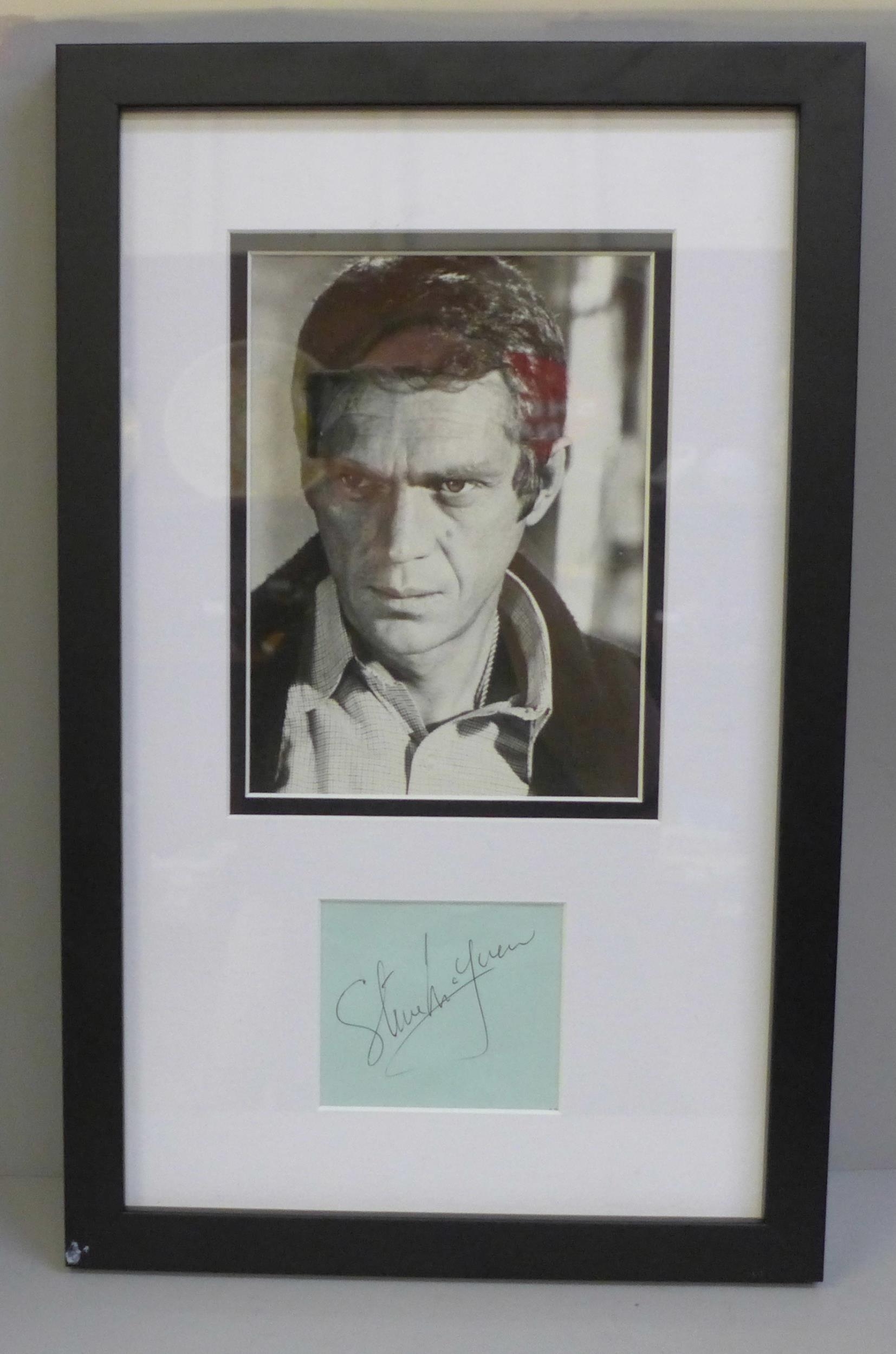 A framed Steve McQueen photograph with signature