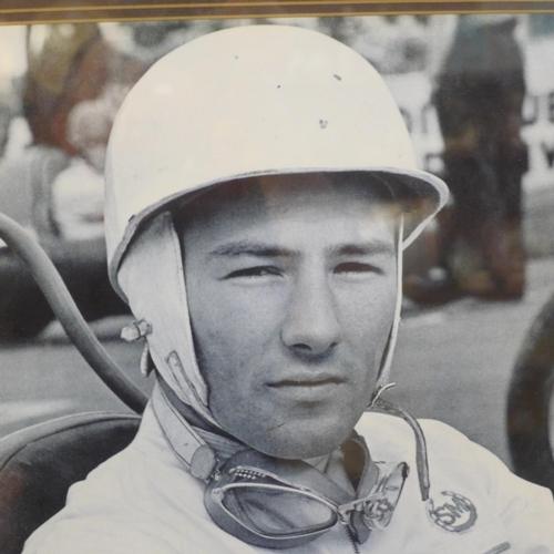 617 - A framed Stirling Moss photograph with signature and certificate of authenticity