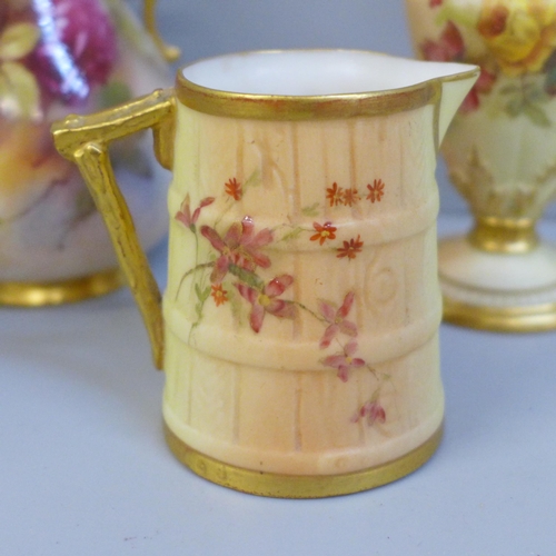 654 - A Royal Worcester blush ivory small pitcher and two vases, all decorated with flowers