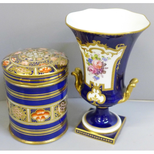 655 - A 19th Century Spode Imari cylindrical pot and cover, a Royal Crown Derby vase decorated with flower... 