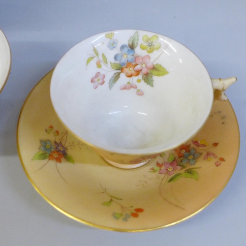 657 - A Royal China Works Worcester blush ivory tea for two tea set, lacking cream jug