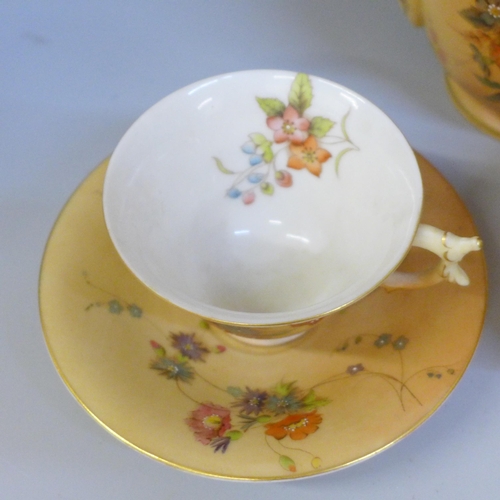 657 - A Royal China Works Worcester blush ivory tea for two tea set, lacking cream jug