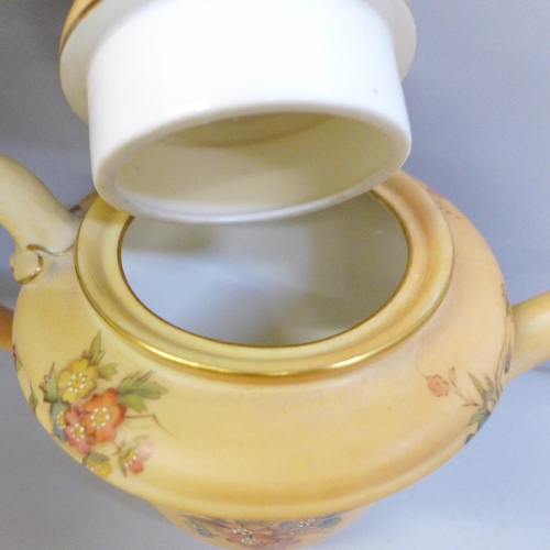 657 - A Royal China Works Worcester blush ivory tea for two tea set, lacking cream jug