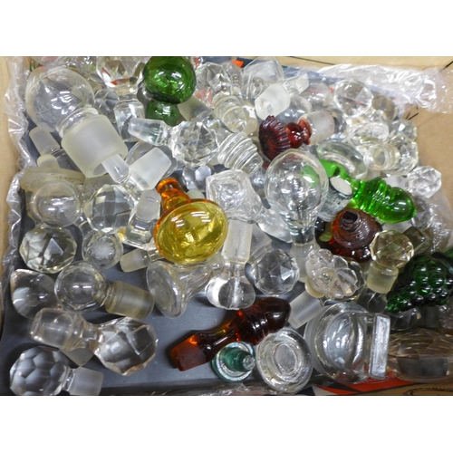 688 - A box of clear and coloured glass stoppers, perfume/scent, etc.