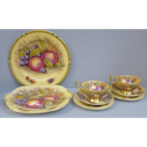 695 - Aynsley Orchard Gold cups, saucers, tea plates, a bread and butter plate and a cabinet plate, signed... 