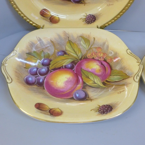 695 - Aynsley Orchard Gold cups, saucers, tea plates, a bread and butter plate and a cabinet plate, signed... 