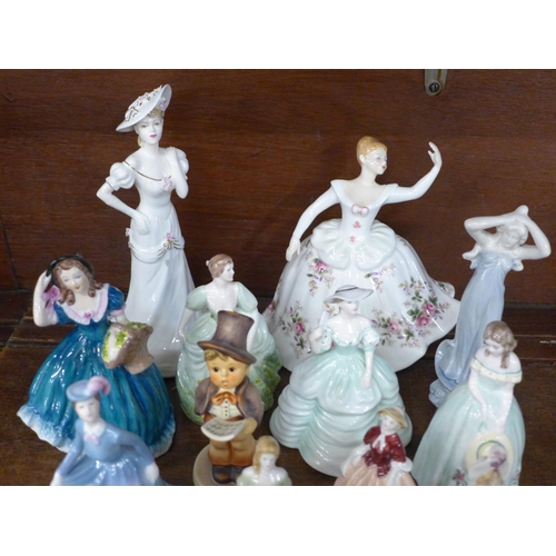 698 - A collection of seventeen porcelain figures; a Royal Doulton Shirley, Wade, Goebel, Coalport Carla, ... 