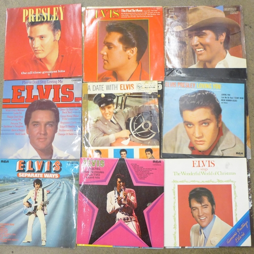 705 - Nineteen Elvis Presley LP records and a book, 'Rock 'n' Roll Legend