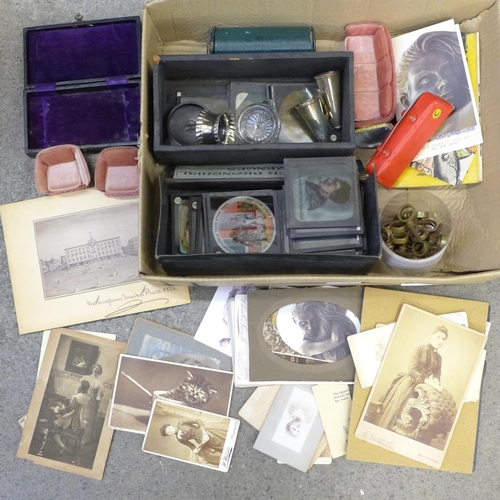 713 - A box of miscellaneous items including coloured lantern slides, stair rod clips, cabinet cards, etc.