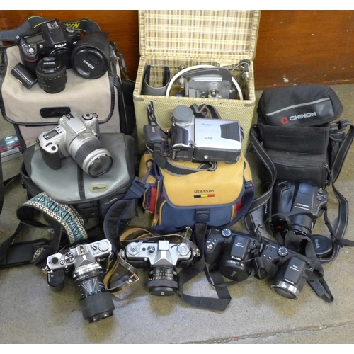 746 - A collection of cameras including a Nikon D80 with three lenses, 50mm, 18-135mm, 55-200mm, SB-600 fl... 