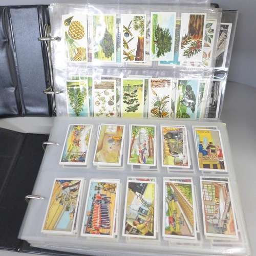 756 - Two albums of cigarette cards; Wills, Gallaher, John Player, Ogdens, Godfrey Phillips