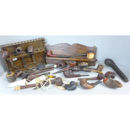 758 - A collection of twenty-three pipes and two pipe racks