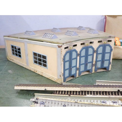 763 - A tin plate model rail engine shed, Chad Valley Overhead Railway and track