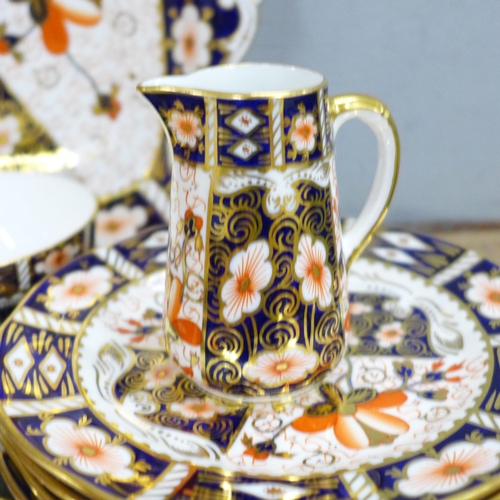 764 - A Royal Crown Derby 2451 Imari six setting tea set, six setting, with two medium plates, bread and b... 