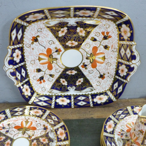 764 - A Royal Crown Derby 2451 Imari six setting tea set, six setting, with two medium plates, bread and b... 